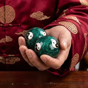 A pair of vintage Chinese Tai Chi Yin Yang metal massage balls for hand relaxation, stress, wrist exercise, hands, with pocket travel box, ideal gift for holidays