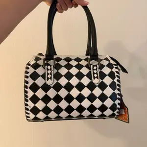 Small Size Checkered Speedy Handbag with Classic Black and White Pattern and Durable Handle