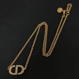 Pre-owned Christian Dior CD Logo Rhinestone Gold Tone Pendant Necklace 11624244046/198203