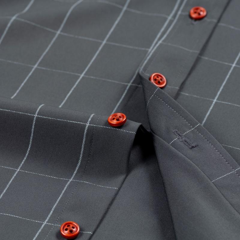 Men’s long-sleeve shirt with four plaid color-block panels, business-casual style. Button-down notched collar design for a sharp look, red buttons add refined details, blue-and-white plaid interior provides visual depth. Long-sleeve fit suitable for multi