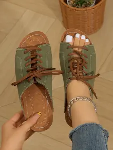 A pair of new women's summer platform wedge sandals, featuring a fabric upper with an adjustable lace-up design, comfortable for wide feet, stylish and versatile women's summer sandals.