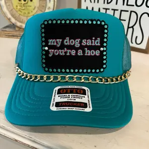 My dog said your a hoe Trucker Hat