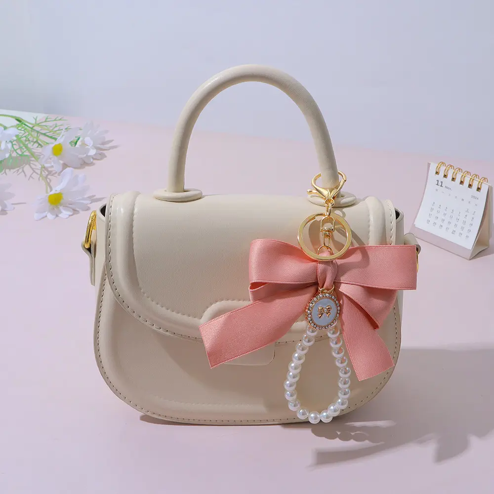 Elegant Bowknot Faux Pearl Charm Keychain for Bags Backpacks Purses Mobilephone Headphones Lightweight Durable Gift for Women Girls Bag Decoration Car Accessory Keychains for Women Car Keys Wristlet Keychains