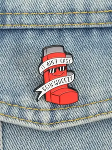 Red Asthma Inhaler & Slogan Design Enamel Brooch, Alloy Brooch Pin, IT AIN'T EASY BEIN' WHEEZY Brooch Alloy Badge for Daily Clothing Decor, Brooch for Jewelry Gift, Awareness Statement Piece, Fashion Accessory