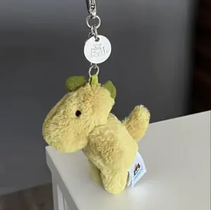 Jellycat Bashful Dino keychain in green.