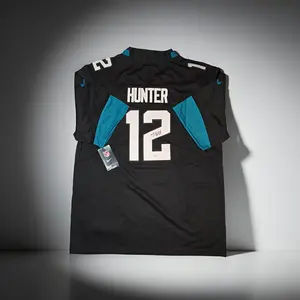 Travis Hunter of the Jacksonville Jaguars autographed football jersey COA (XL)