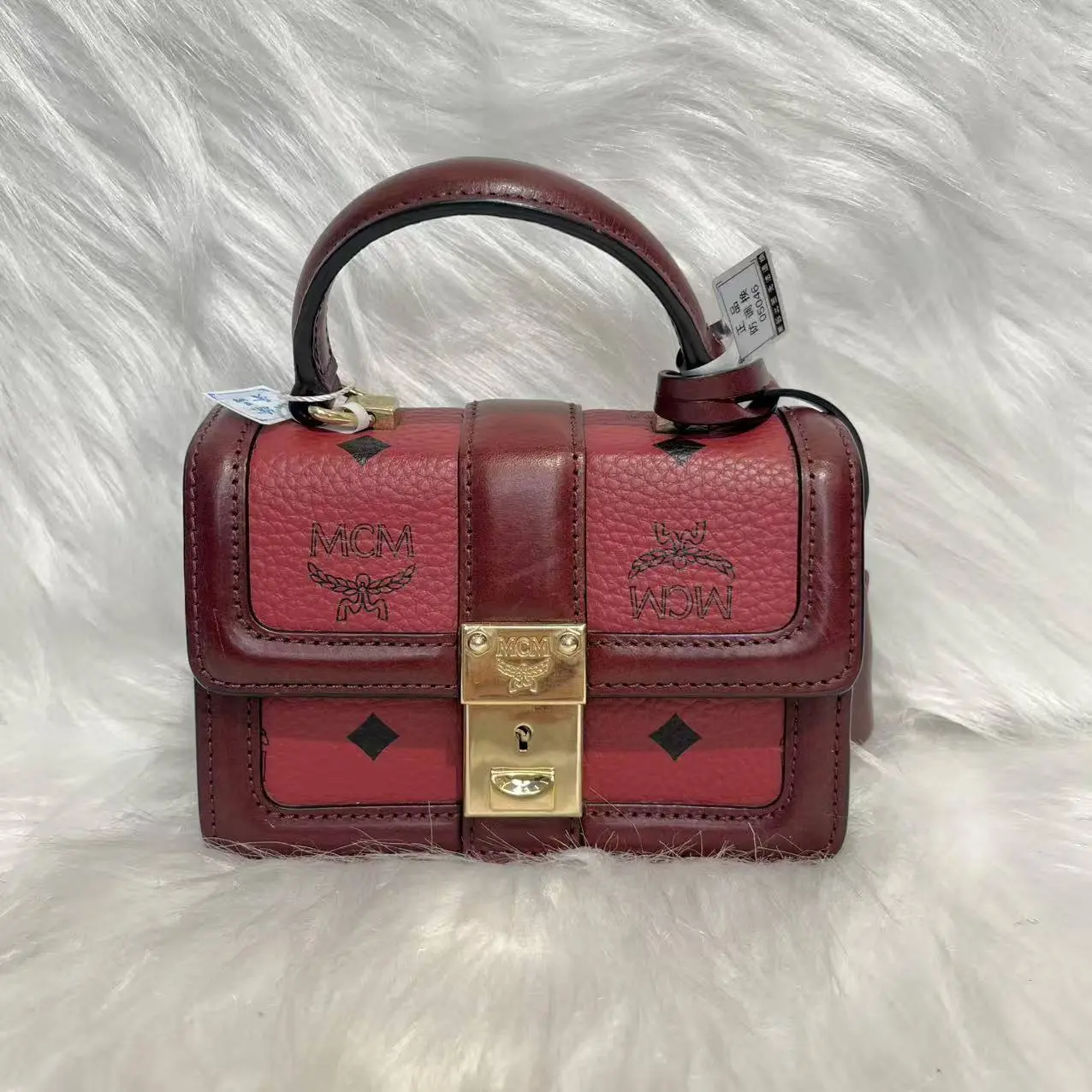 Pre-owned MCM Mini Burgundy Two Tone Visetos Trunk Bag Gold Engraved Logo Turn Lock Curved Top Handle Crossbody