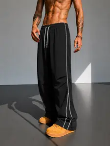 Mens Loose Track Pants with Side Piping Split Hem Elastic Waist Drawstring Straight Leg Athletic Casual Pants Lightweight Smooth Feel Athleisure Streetwear Bottoms for Gym Travel Lounge Summer Daily Wear Open Hem Detail