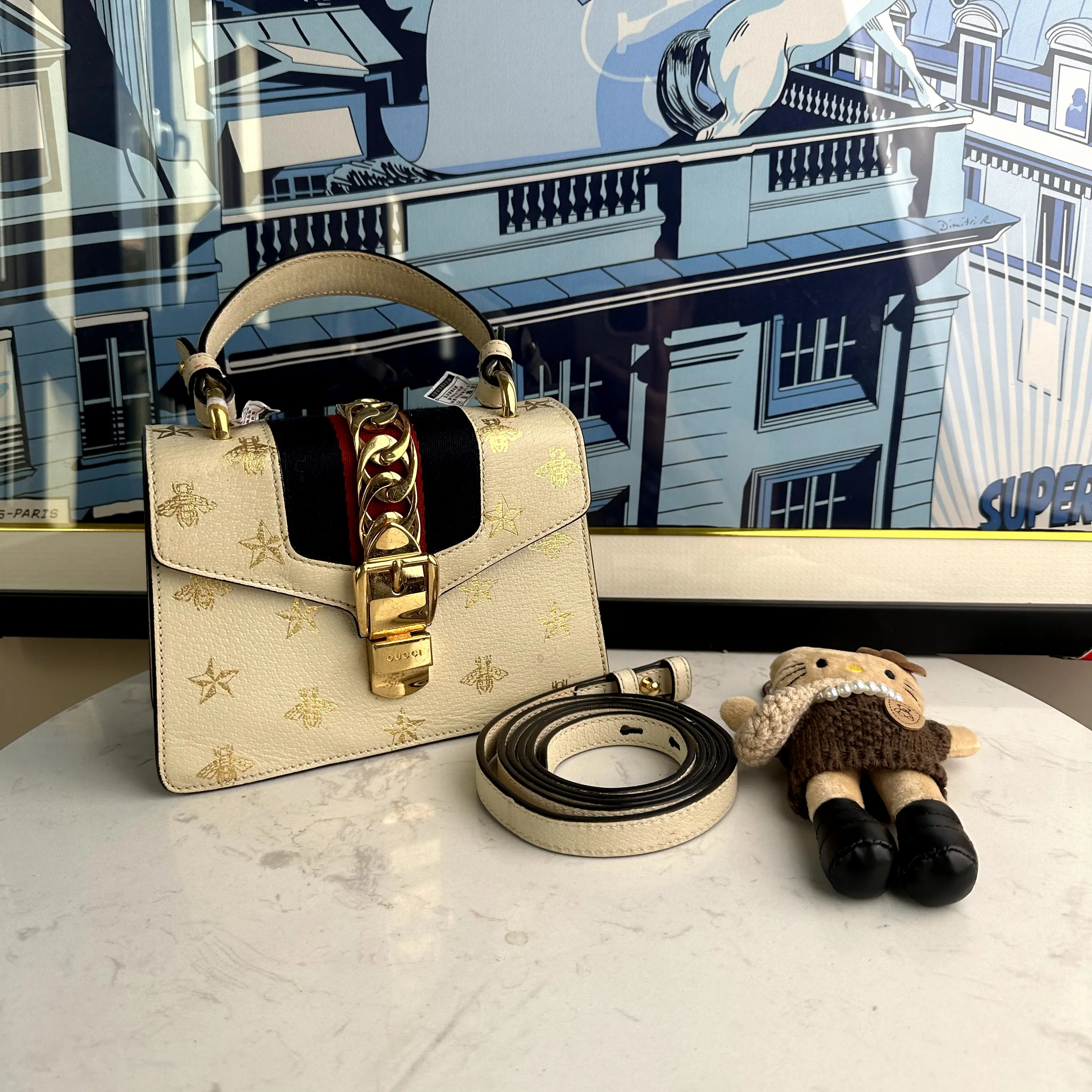 Pre-owned GUCCI Sylvie platinum handbag with bee and star detailing, includes original shoulder strap a338