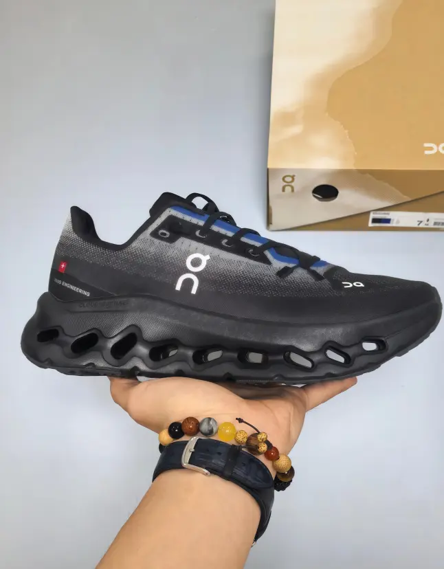Gradient black mesh sneakers with cool blue laces, rugged hollow wave midsole, this pair of sneakers fits outdoor hiking and rough trail trips