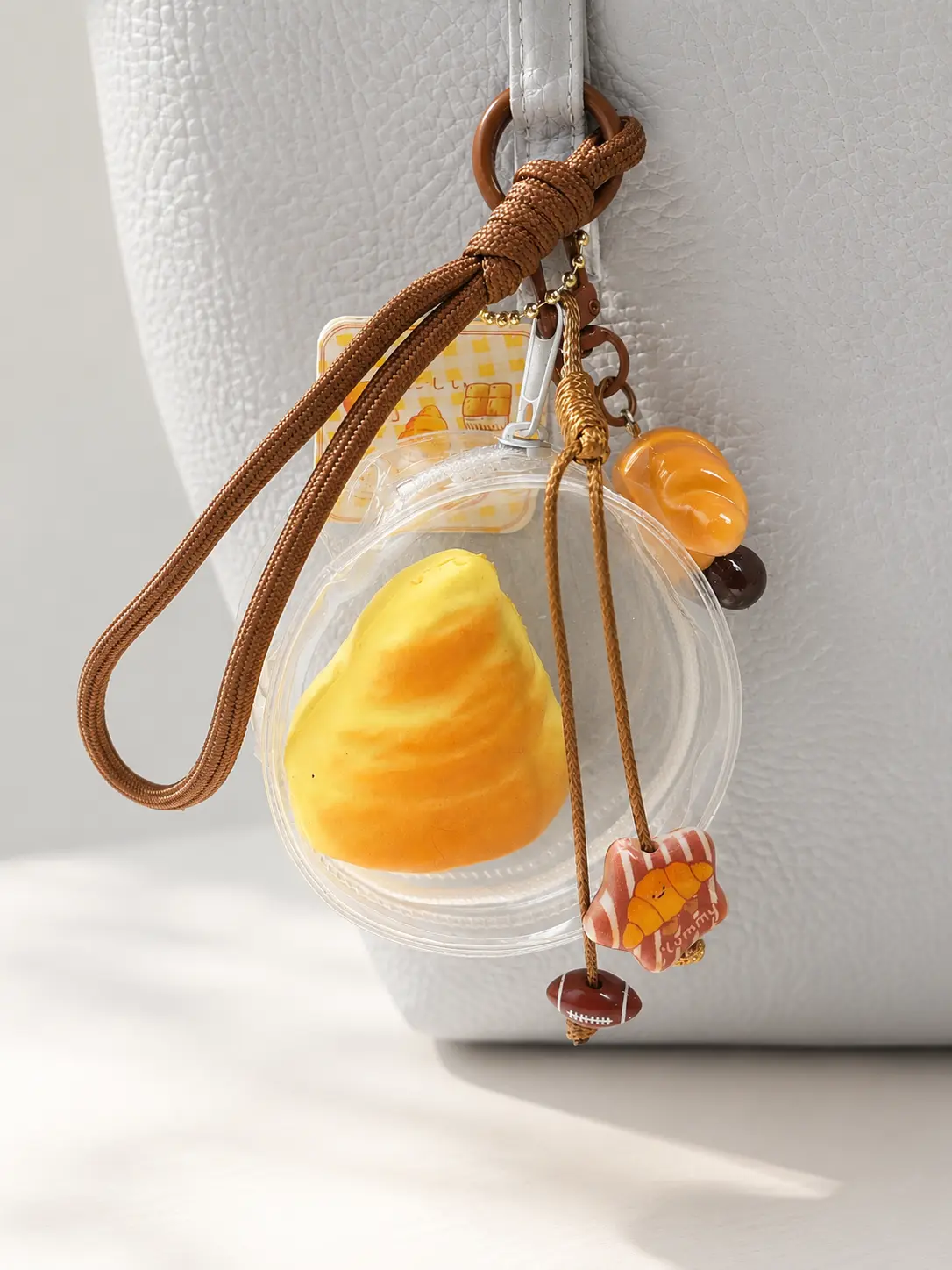 Croissant Squishy Keychain, Kawaii Slow Rising Bread Squishy Bag Charm with Braided Rope Wristlet, Cute Ceramic Croissant Pendant Purse Accessory, Soft Squishies Stress Relief Fidget Toy Gift for Girls