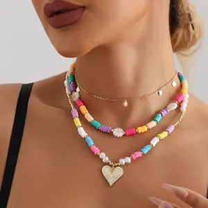 Colorful bohemian style multi-layered beaded daisy and heart pendant necklace, perfect for women's casual wear, charm necklace