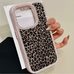 A Shiny Leopard Print Flip Phone Case with Diamonds, Compatible with iPhone 16 ProMax, 16, 15 Pro, 14, 14 Plus, 14 ProMax, 13, 13 Pro, 12 Pro, and 11 ProMax Models. This Soft Phone Case is Designed to Resist Drops and Stains, Perfect for Men and Women