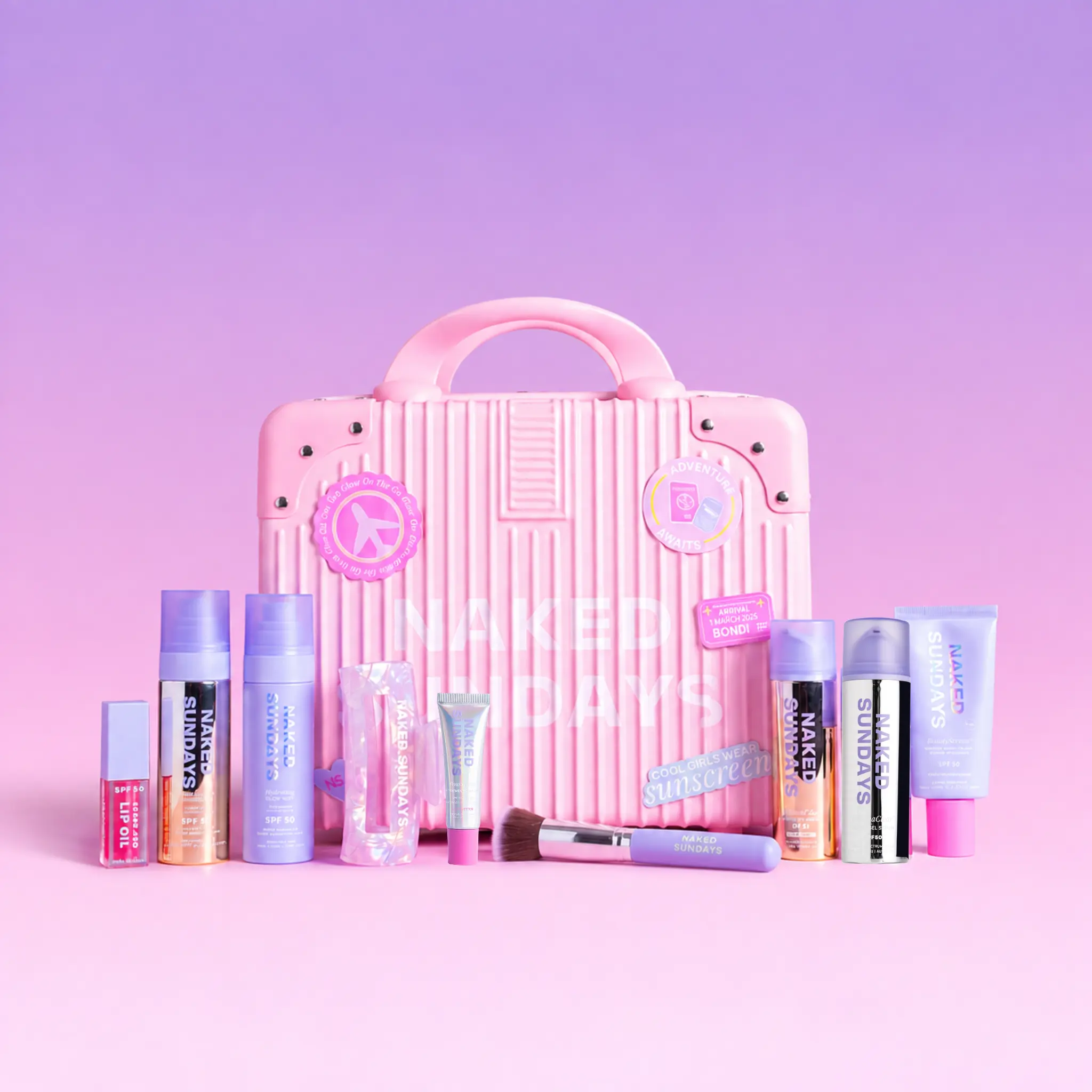 First Class Jetsetter Beauty Bundle Kit - Mini Exclusive Pink Suitcase plus Naked Sundays bestselling SPF and Skincare products  (SAVE 60%)
