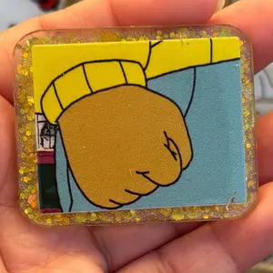 Arthurs Fist Meme Badge Reel - Glossy Cartoon Fist Design, 360° Swivel Alligator Clip, Retractable Cord, Perfect Gift for Nurses Teachers Office Queens