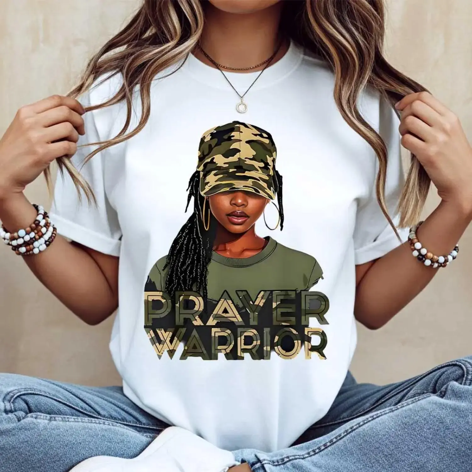 Casual Women's White TShirt Featuring Prayer Warrior Graphic Paired with Camouflage Hat and Braided Hair for Daily Wear