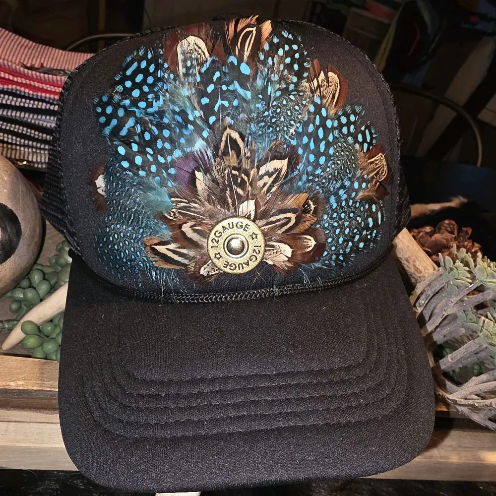 Pheasant feather trucker hat on black with tourquoise accent