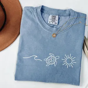 Comfort Colors ocean turtle sun T-shirt, soft and breathable summer tee for women, perfect for beach days, vacations, and thoughtful warm-weather gifts.