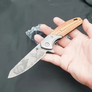 Stainless steel knife with solid wood handle, deer art pattern, collectible item