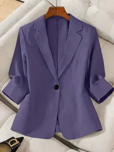A women's solid color lapel single-breasted single-button mid-length sleeve double-pocket stylish blazer, suitable for spring and summer, appropriate for the workplace and daily wear.