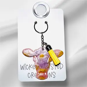 Unique Handmade Craftsmanship Pink and Yellow Moo Moo Mood Collectible Keychain - Udderly Adorable Collectible for Entertainment Enthusiasts