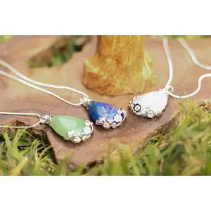 Flower Wrapped Oval Faceted Pendant