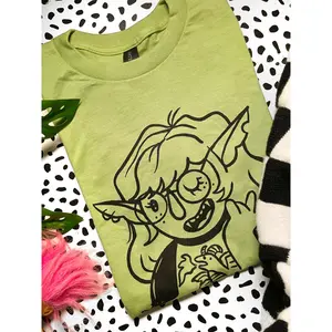 Orc girl on avocado green unisex shirt. Printed in Long Beach, CA.