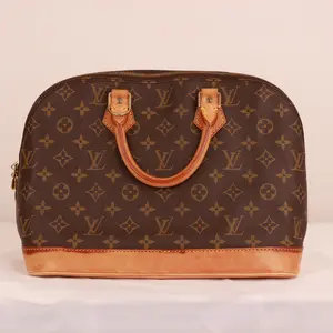Pre-owned Louis Vuitton Monogram Alma PM Handbag in Monogram Canvas with Natural Vachetta Leather Trim Japan