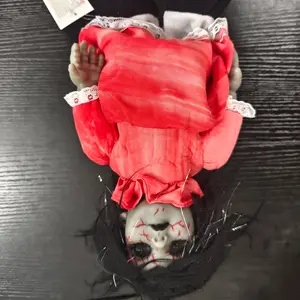 34cm Voice-activated—Glow-in-the-dark and sound-emitting Halloween decorations; walking dolls for voice-activated, glow-in-the-dark bar or haunted house scene displays; creative, spooky-faced dolls; requires 3 AA batteries (not included); in a box.