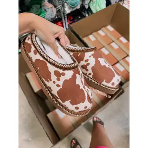 Cow print bruin slippers