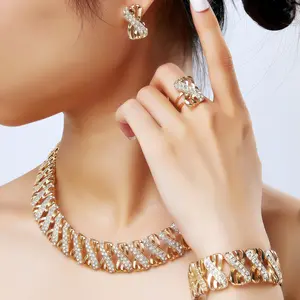 4 Piece Traditional Bridal Jewelry Set Golden Stylish Bow Infinity Design with Rhinestones to match your everyday outfit.