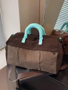 Elegant women's bag with a casual and personalized design, a travel bag with large capacity and multiple pockets for storage, adjustable wide shoulder straps, and versatile texture, suitable for business trips, travel, and fitness, Travel Duffle Bag