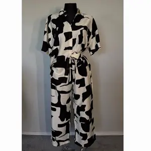 Set Urban Black Cow Print Jumpsuit with Drawstring Waist and Short Sleeves for Women