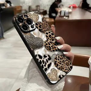 A phone case with leopard heart pattern, featuring gold details and animal print design, suitable for iPhone 17 16, 15, 14, 13, 12, 11 Plus Pro Max