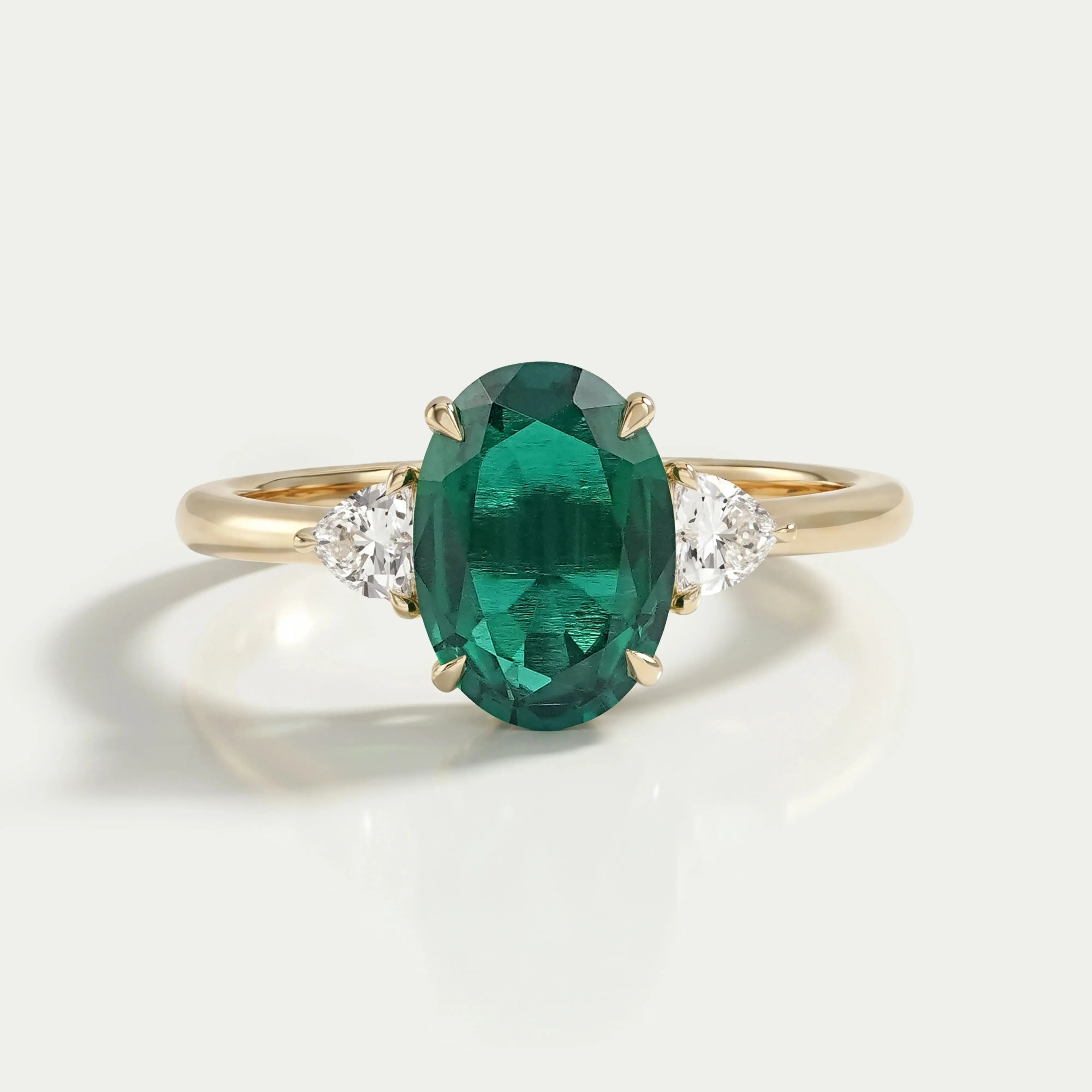 Trilogy Zambian Green Oval Gemstone And Trillion Cut Ring