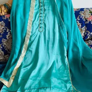 Beautiful  Pakistani  dress M size turquoise color  pure silk by hand made and mirror less in the qameez with plain trouser and georgette dupatta