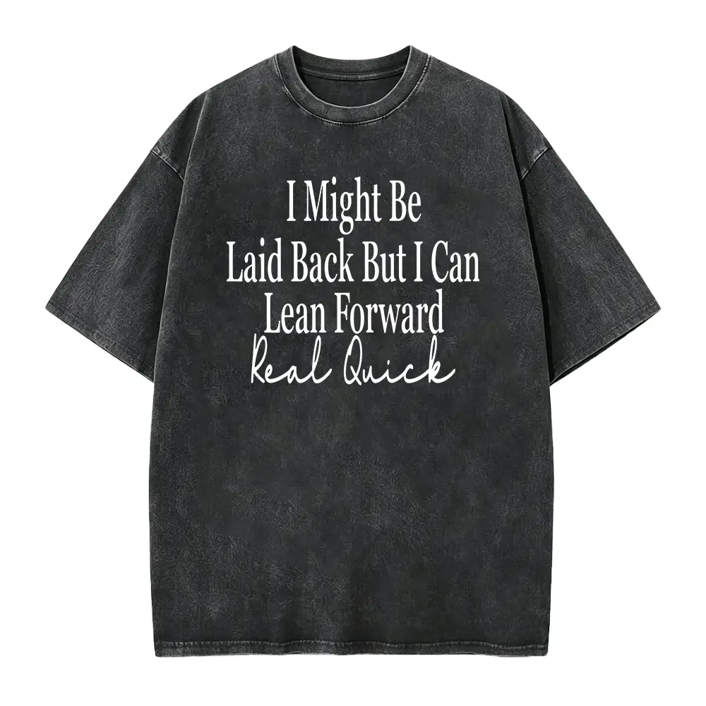 Unisex Crew Neck T-shirt, with Bold Cursive Prints Of White Text On The Front: "I Might, " "Leisurely But I Can, " "Lean Forward Quickly, " And "Really Fast." Fashionable And Casual T-shirt Against A Light Wood Grain Background.