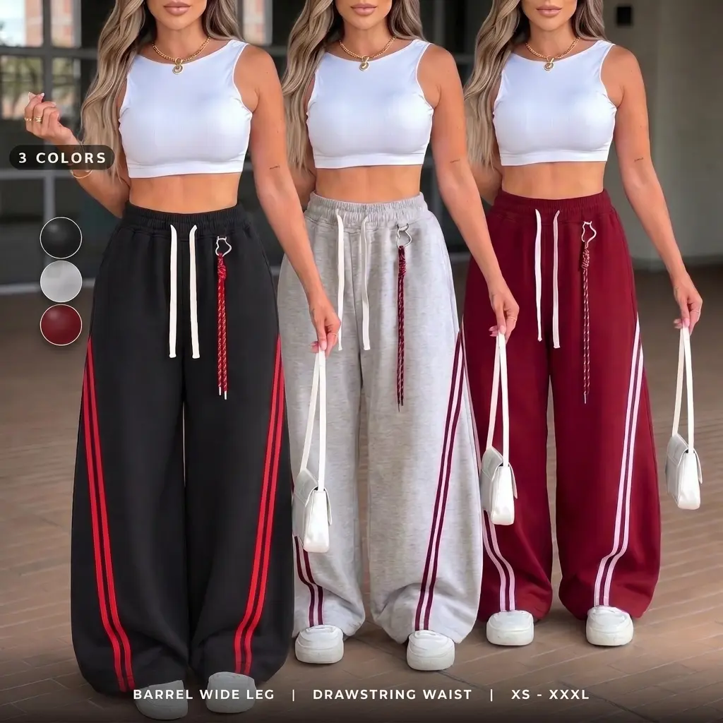 Plus-size women’s wide-leg athletic pants, available in three colors, featuring barrel-shaped legs, side stripes, and a drawstring waist.