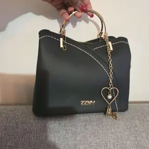 ZZMY Elegant Black Handbag with Gold Chain Heart Charm and Pearl Detail for Women