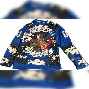 Block Babies Blue Team Jersey - Long Sleeve Design with Graphic Print Featuring "BLOCK BABIES EST." and Character Illustrations