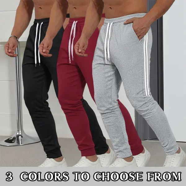 Men’s slim tapered sweatpants with side double stripes, drawstring elastic waistband, classic two-white stripe design; suitable for gym, running, everyday streetwear, casual wear, and home workouts; available in three colors.