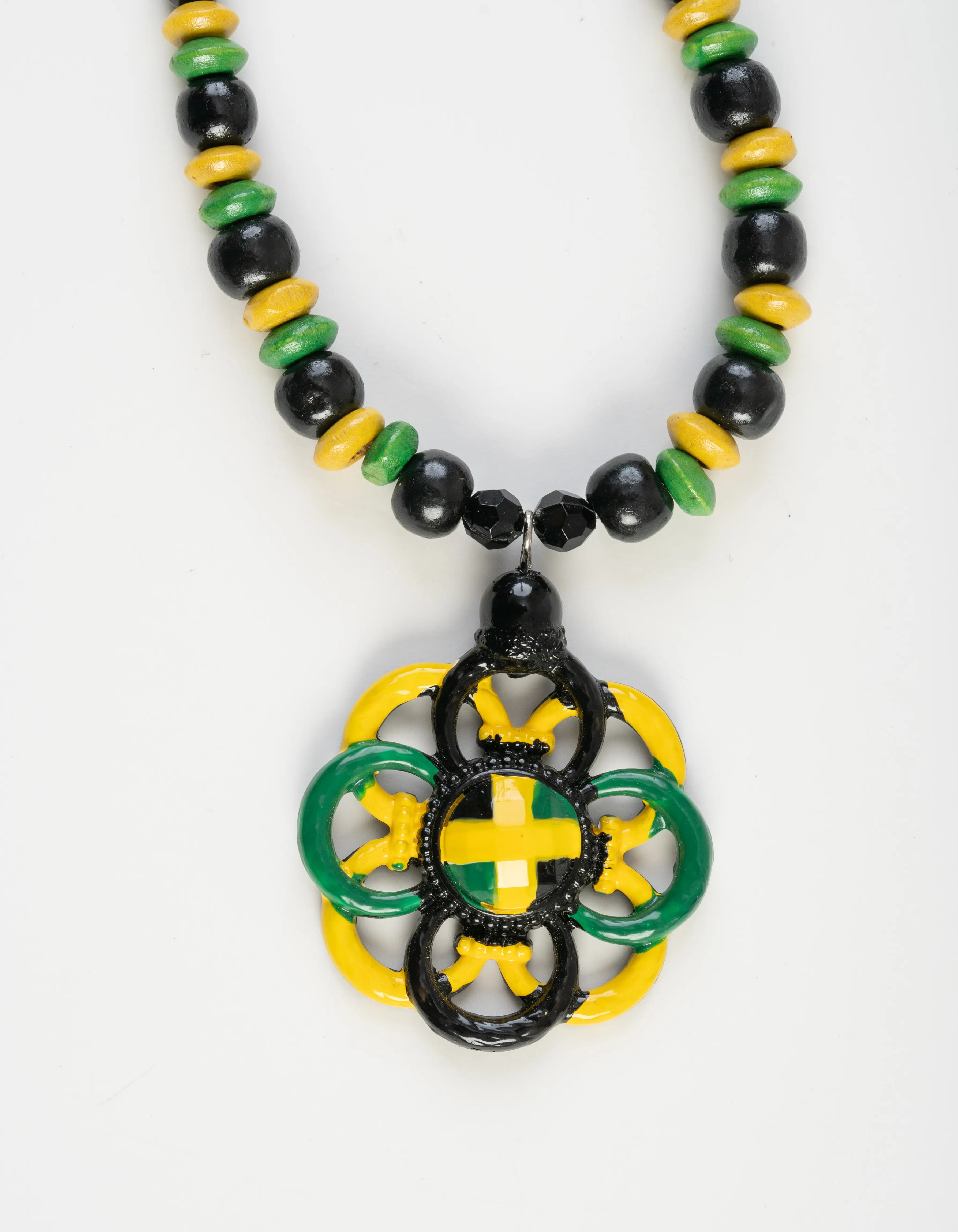 Metal flower , hand painted Jamaican colors pendant and beaded necklace