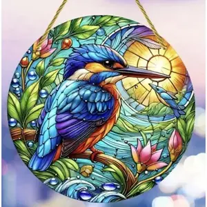 Stained glass acrylic suncatcher blue bird on branch with sunrise.