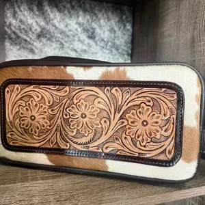 Cowhide with Intricate Floral Embossing and Leather Trim toiletry bag for Men and Women