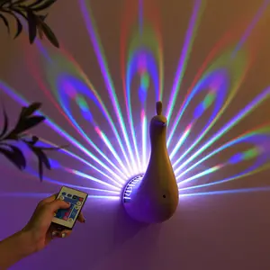 Peacock wall lamp, seven-color peacock lamp, with remote control and timer function, USB rechargeable peacock ambient light, projector lamp, party light, suitable for family living room decoration.