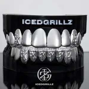 The Embossed EK Letter Diamond Band Full Silver Grillz