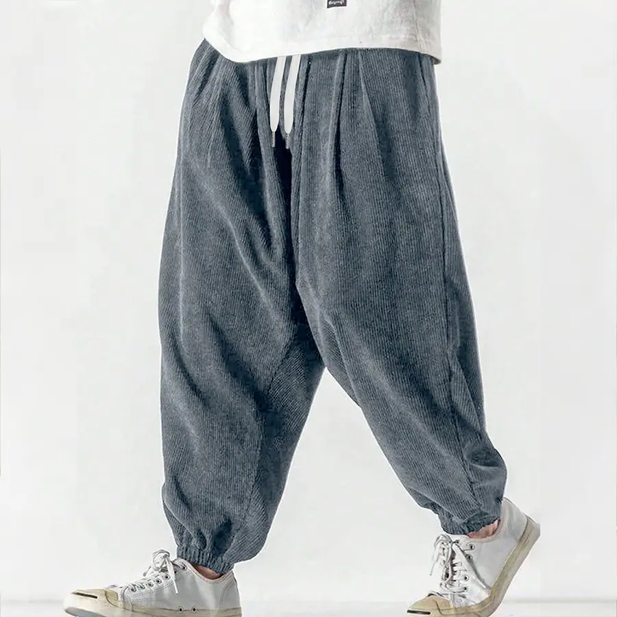 A pair of men's corduroy jogger-style casual pants,Menswear， with a drawstring design, a loose and basic style, machine washable and hand washable, suitable for daily commuting and street wear. Menswear Menswear