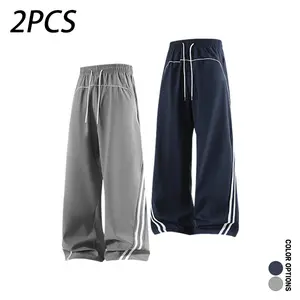 Pack of 2 men’s casual long pants for spring/autumn, featuring color-block striped patchwork and a deconstructed design. Loose fit with a drawstring elastic waistband; versatile for everyday wear, leisure, sports, and fitness.