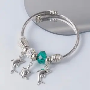 Pulsera Elegante Serie Oceánica con Encanto de Delfín Azul Lago de plata