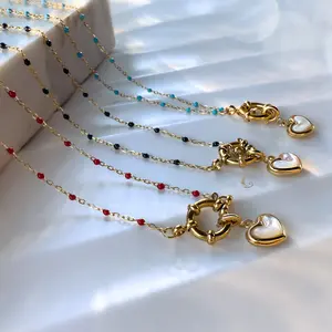 Alia – Light Blue Beaded Necklace with Mother of Pearl Heart Charm.
